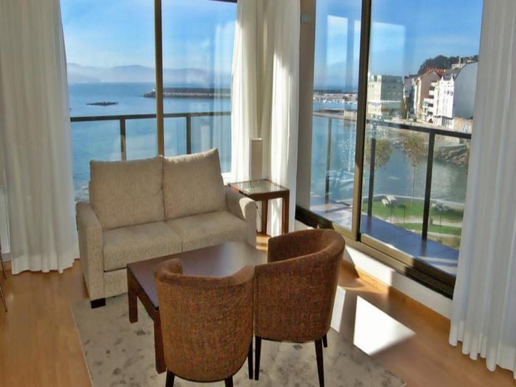 Apartamentos Turisticos Playa De Osmo Corme Bagian luar foto