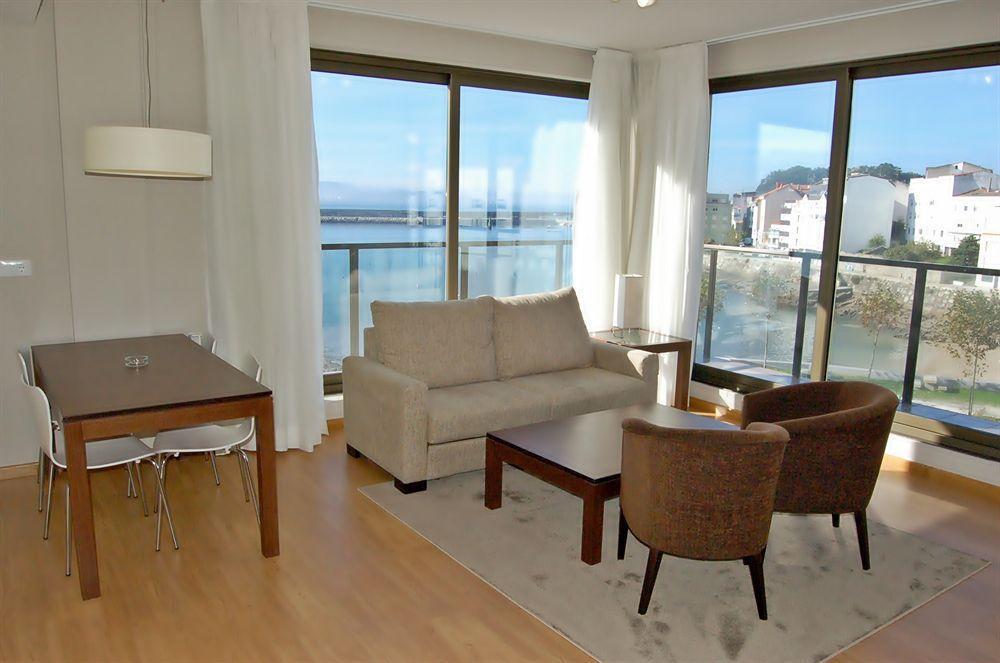 Apartamentos Turisticos Playa De Osmo Corme Bagian luar foto
