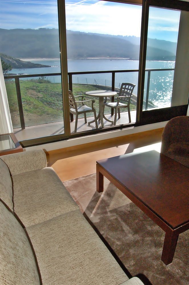 Apartamentos Turisticos Playa De Osmo Corme Bagian luar foto