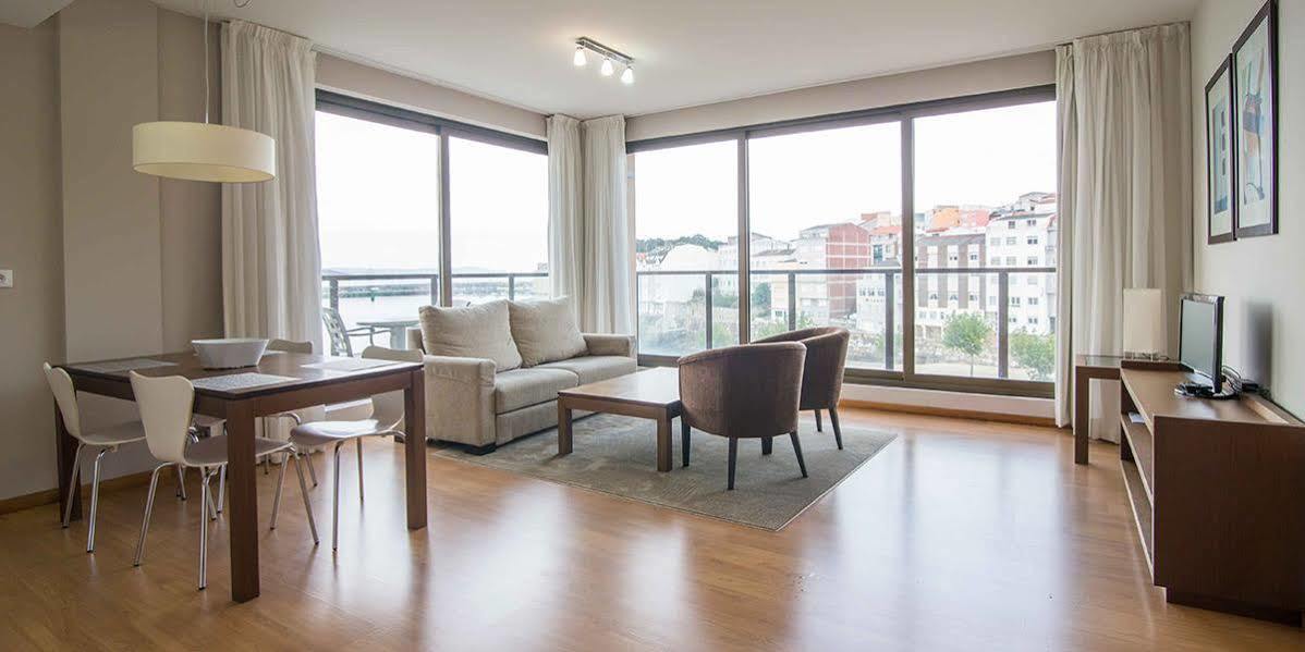 Apartamentos Turisticos Playa De Osmo Corme Bagian luar foto