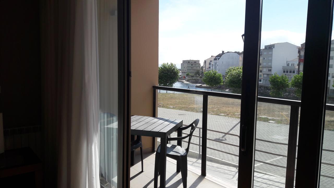 Apartamentos Turisticos Playa De Osmo Corme Bagian luar foto