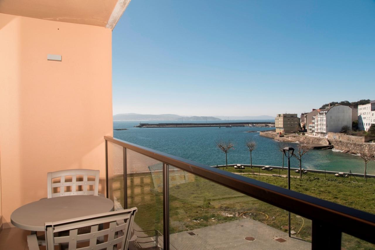 Apartamentos Turisticos Playa De Osmo Corme Bagian luar foto